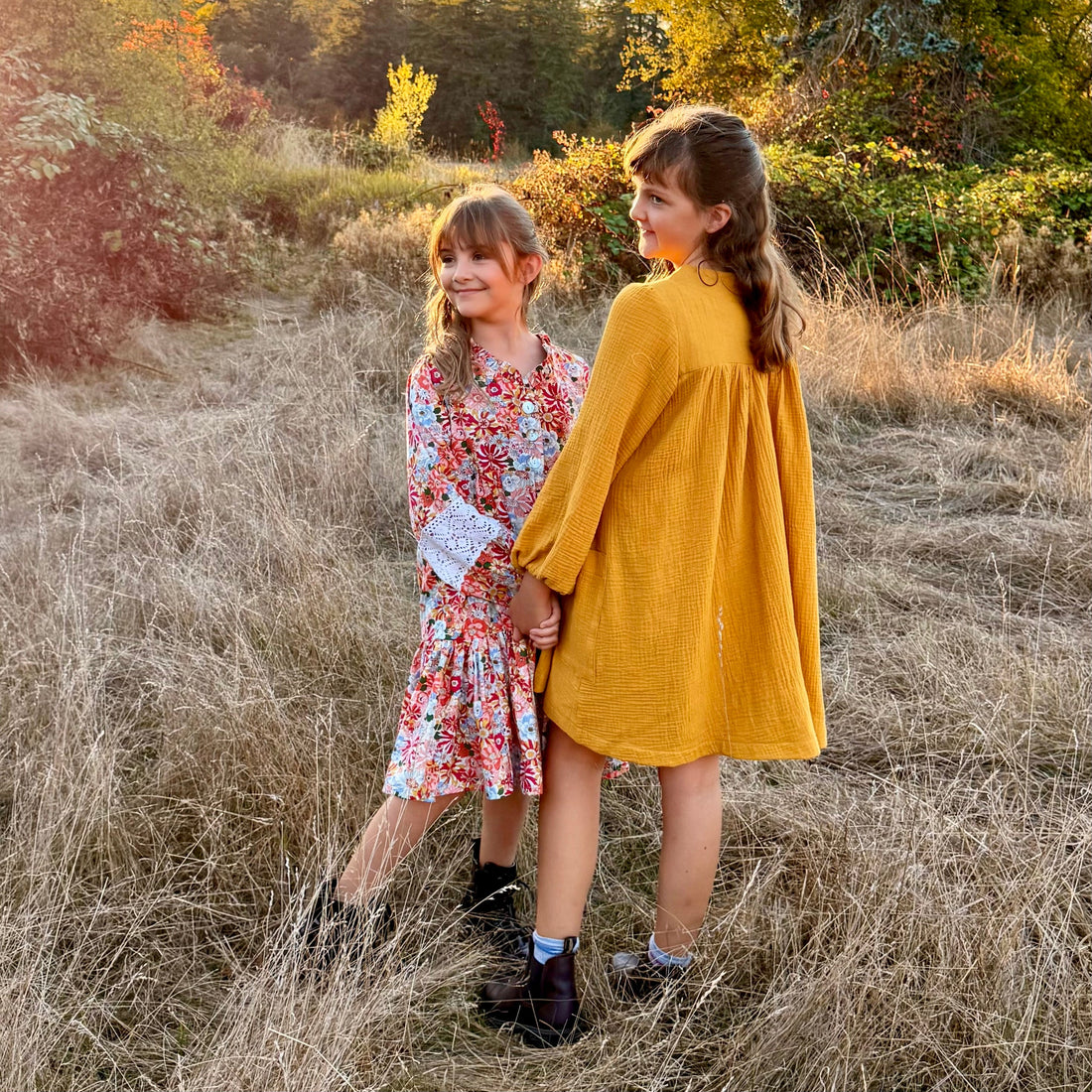 girls in the field at sundown