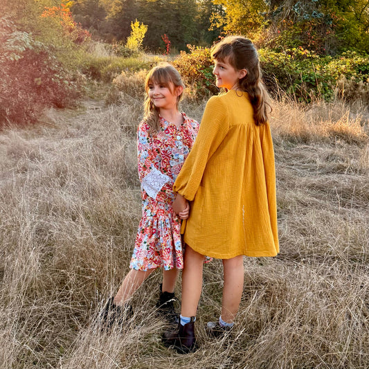 girls in the field at sundown
