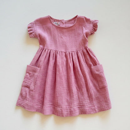 Pink checkered dress with short sleeves on a white background