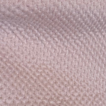 Close-up of a textured beige fabric surface