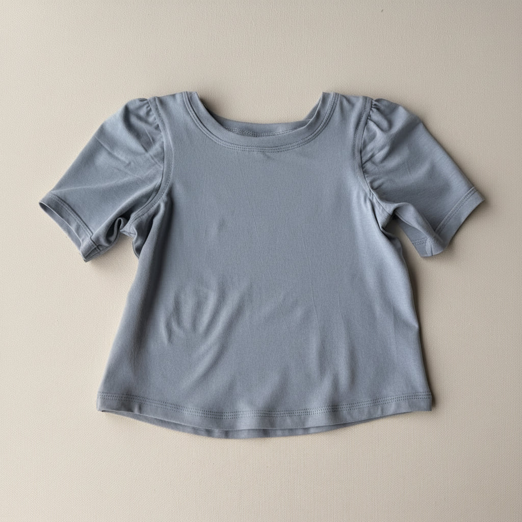 Gray t-shirt on a beige background