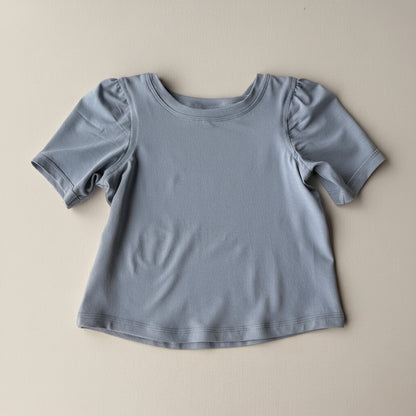 Gray t-shirt on a beige background